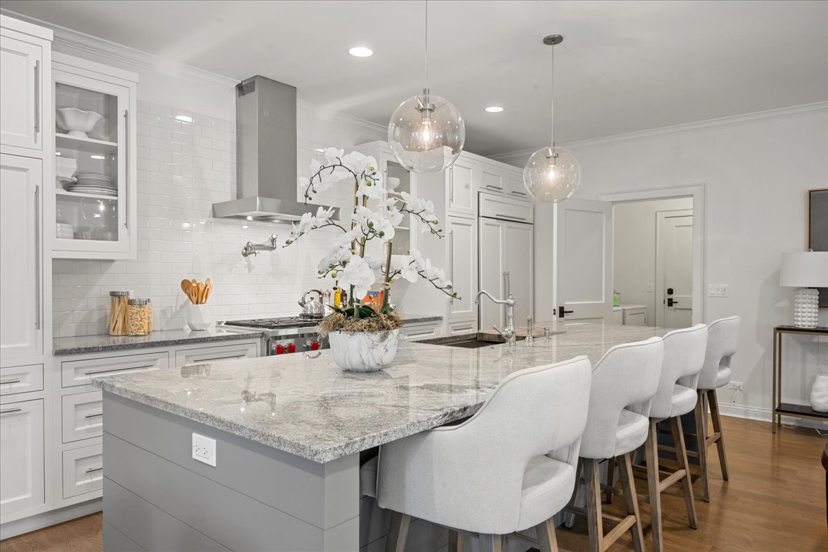 1625 Sunset Ridge Road Glenview, IL 60025 - Photo 13 of 49 a kitchen with center island table and chairs in it