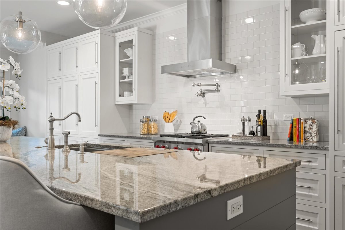 1625 Sunset Ridge Road Glenview, IL 60025 - Photo 18 of 49 a kitchen with granite countertop a sink a stove and cabinets