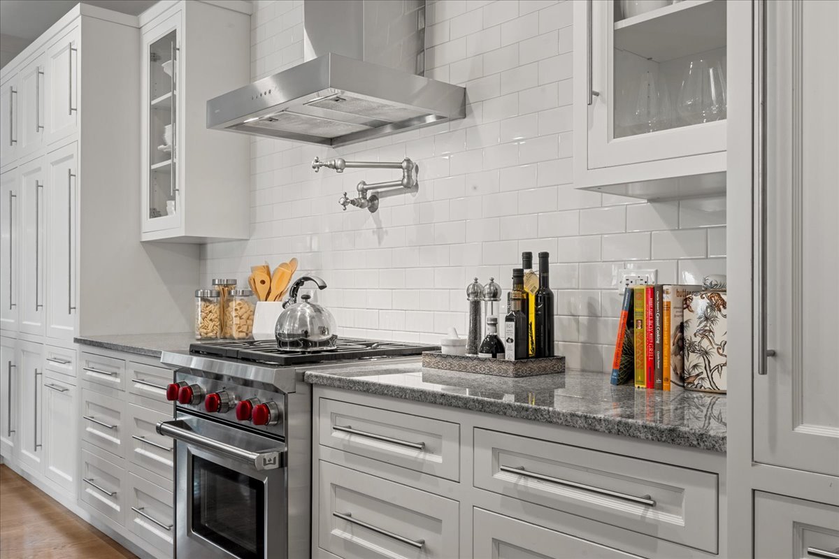 1625 Sunset Ridge Road Glenview, IL 60025 - Photo 19 of 49 a kitchen with granite countertop a stove and cabinets