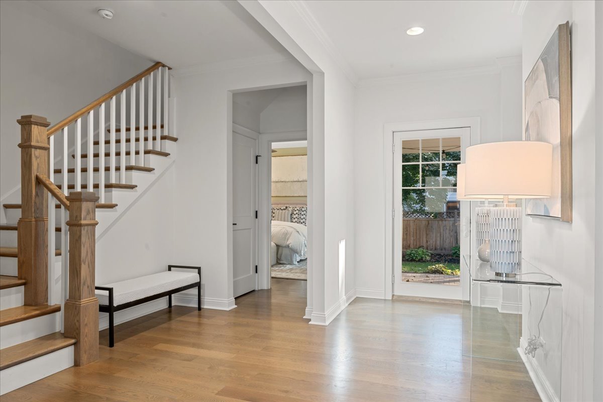 1625 Sunset Ridge Road Glenview, IL 60025 - Photo 2 of 49 a view of entryway with wooden floor and stairs