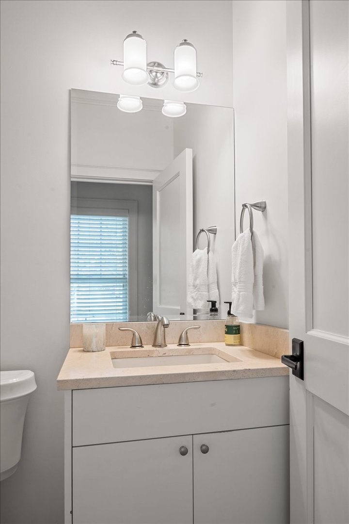 1625 Sunset Ridge Road Glenview, IL 60025 - Photo 24 of 49 a bathroom with a sink a toilet and a mirror
