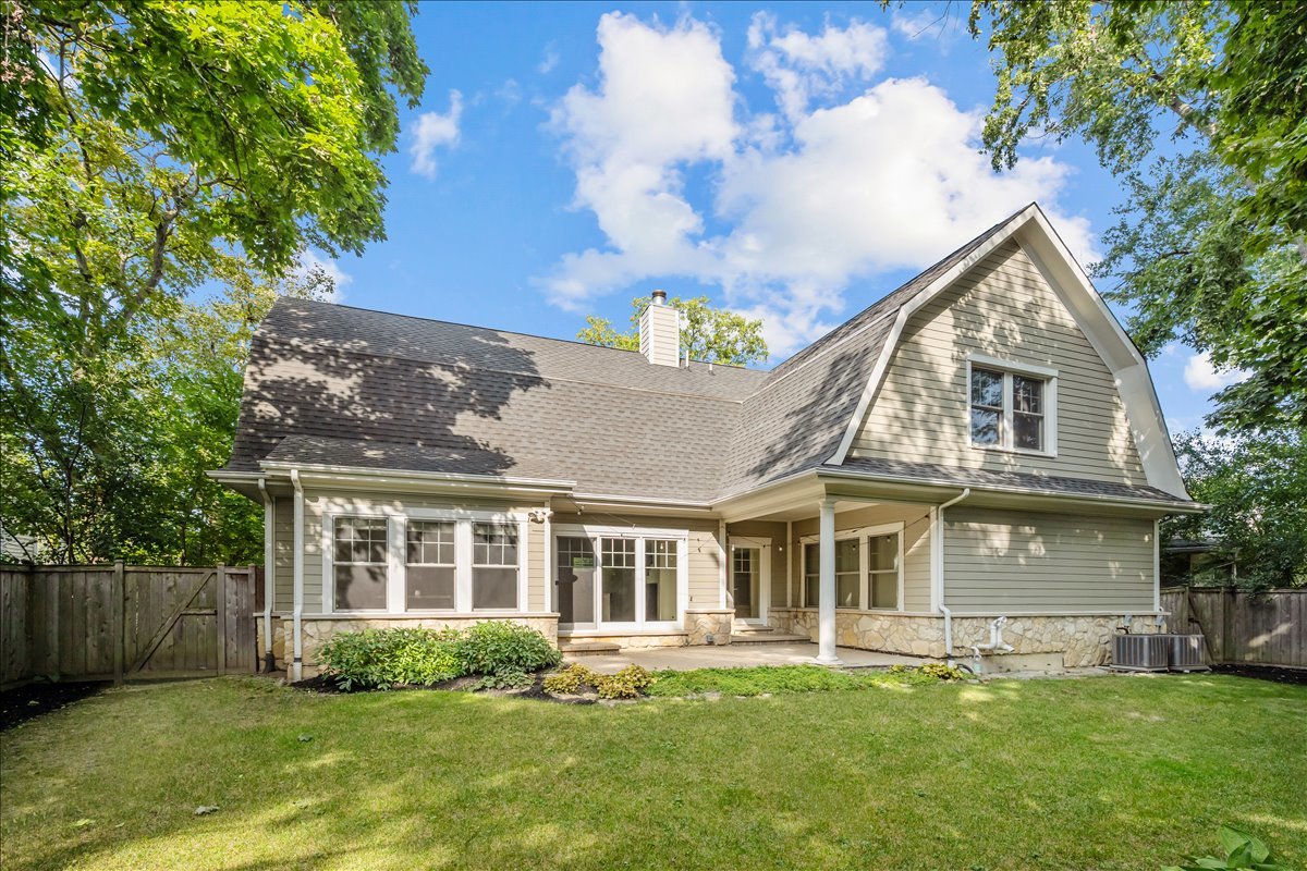 1625 Sunset Ridge Road Glenview, IL 60025 - Photo 25 of 49 a front view of a house with a yard