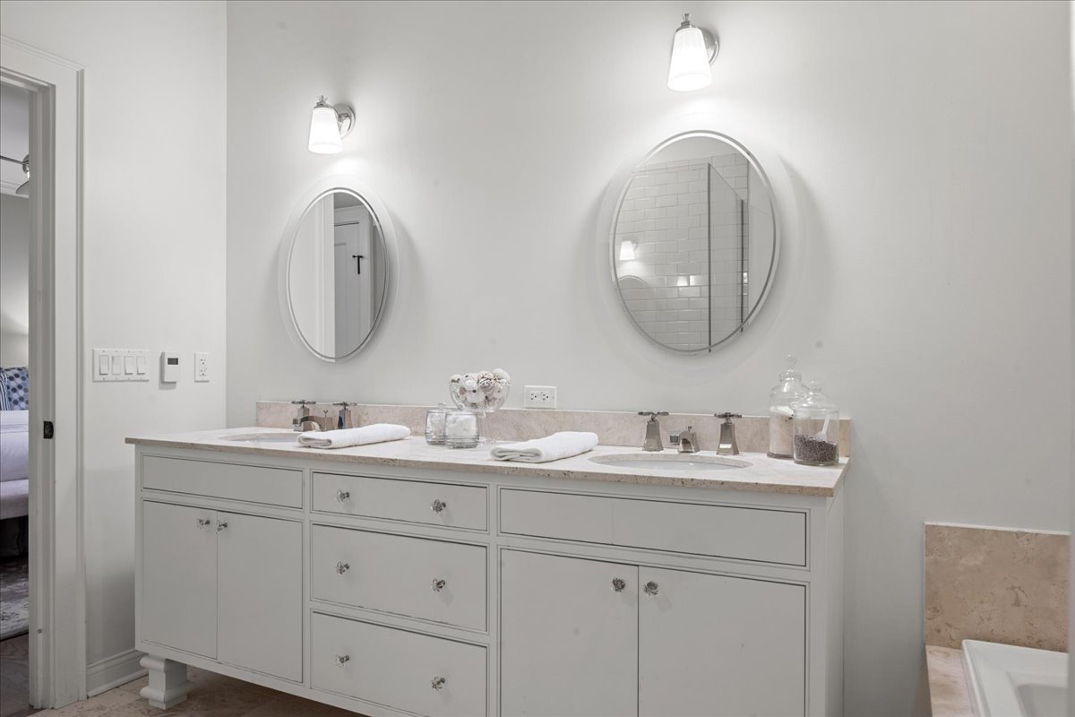 1625 Sunset Ridge Road Glenview, IL 60025 - Photo 31 of 49 a bathroom with 2 sink and a mirror