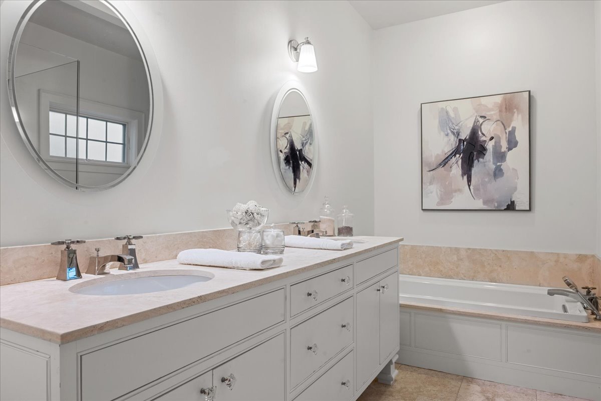 1625 Sunset Ridge Road Glenview, IL 60025 - Photo 32 of 49 a bathroom with a sink and a mirror