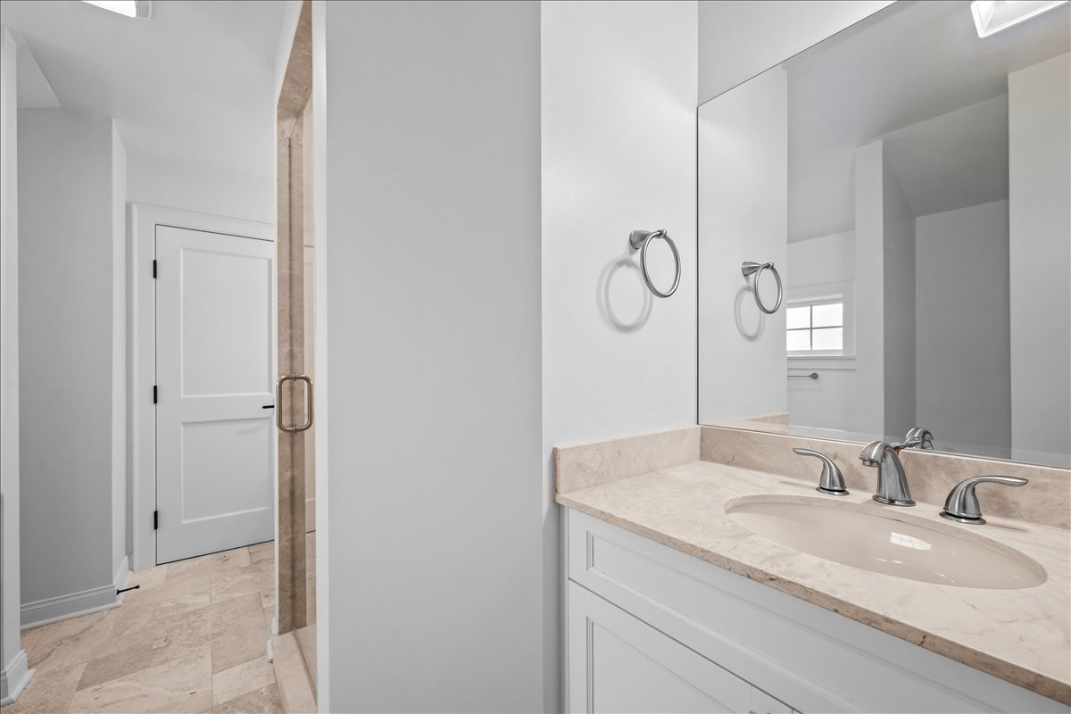 1625 Sunset Ridge Road Glenview, IL 60025 - Photo 35 of 49 a bathroom with a granite countertop sink a mirror and shower