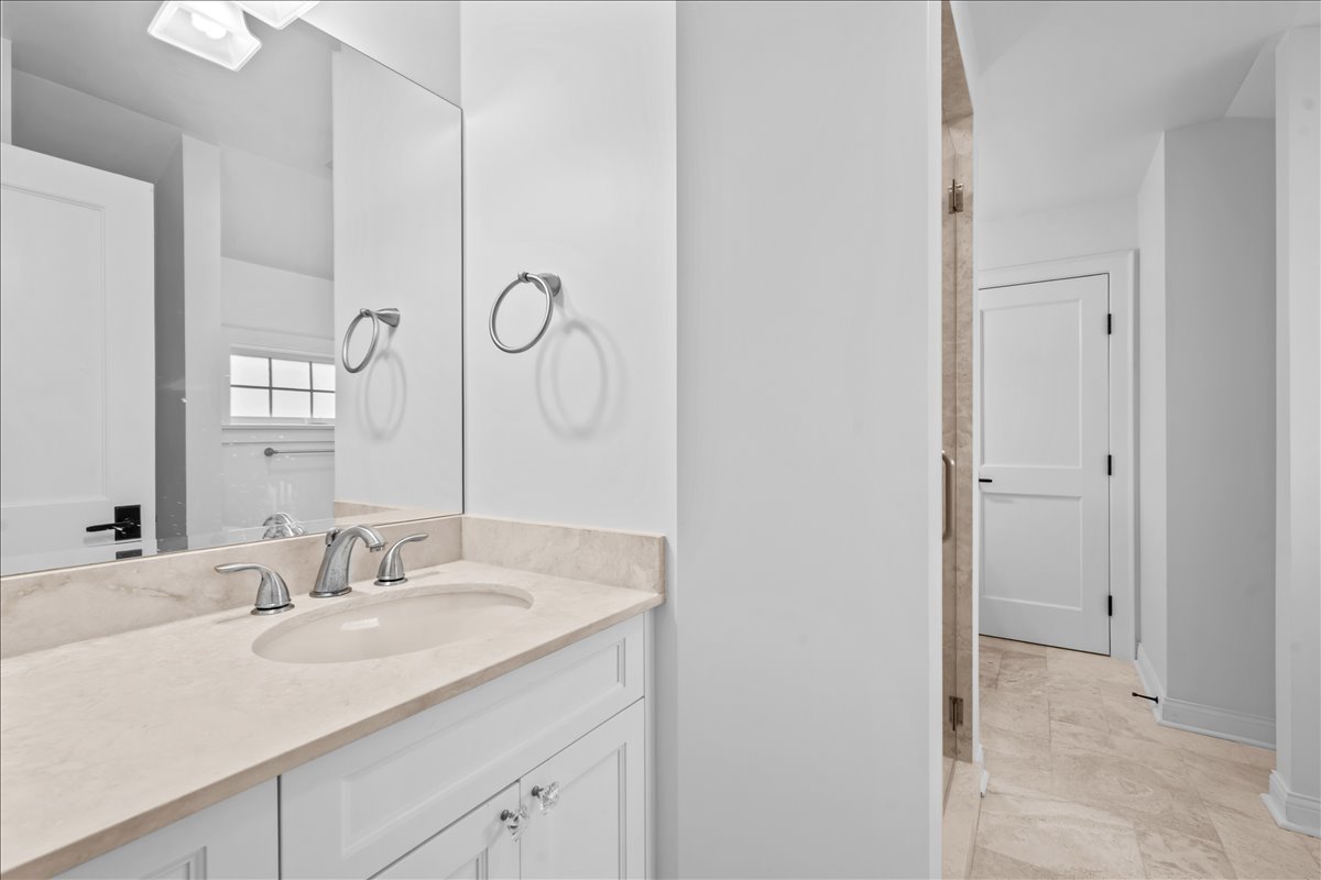 1625 Sunset Ridge Road Glenview, IL 60025 - Photo 37 of 49 a bathroom with a sink and a mirror