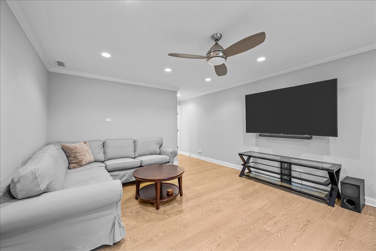 1625 Sunset Ridge Road Glenview, IL 60025 - Photo 38 of 49 a living room with furniture and a flat screen tv