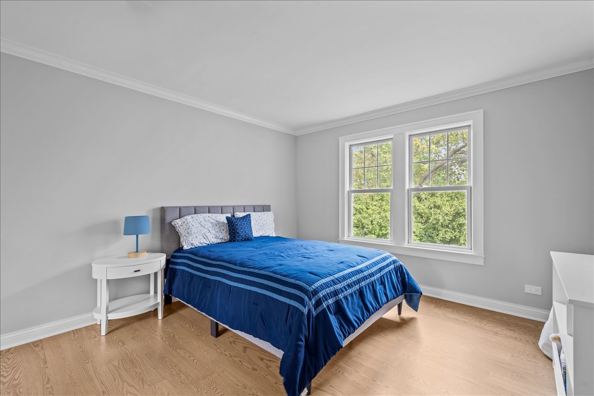 1625 Sunset Ridge Road Glenview, IL 60025 - Photo 39 of 49 a bedroom with a bed and window