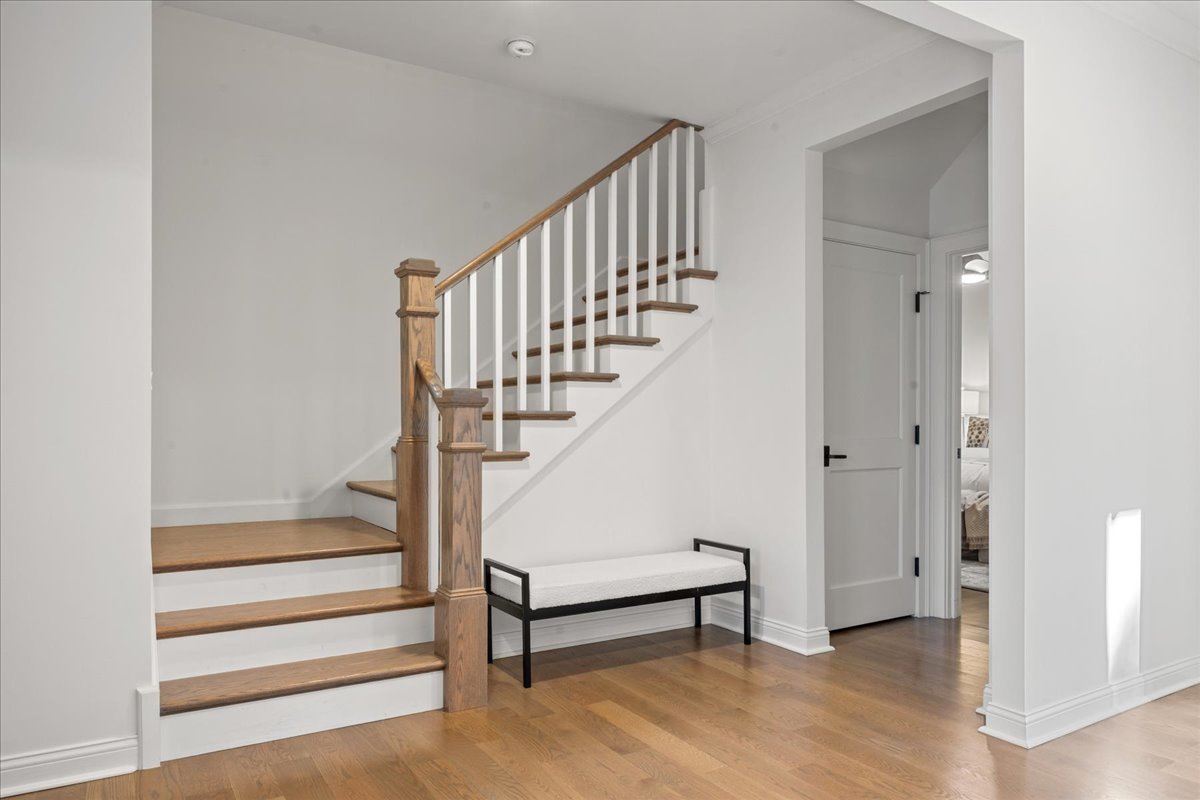 1625 Sunset Ridge Road Glenview, IL 60025 - Photo 4 of 49 a view of entryway with wooden floor and stairs