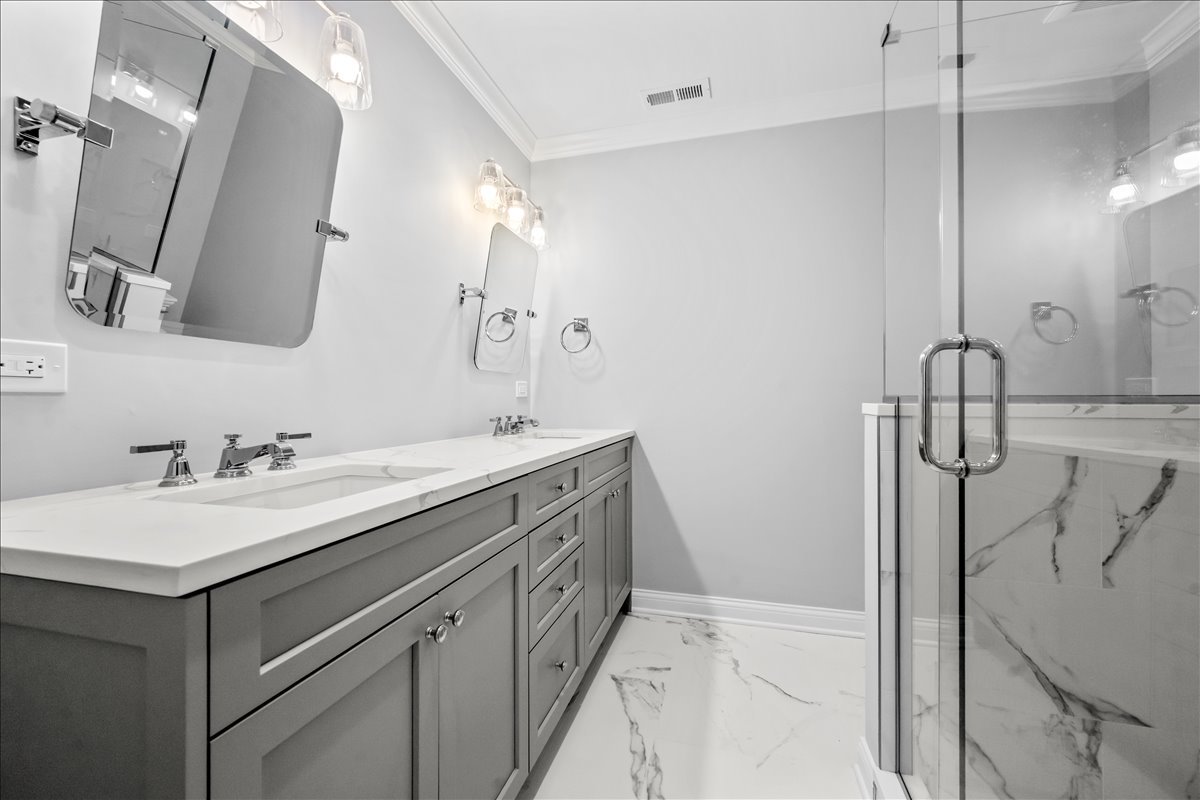 1625 Sunset Ridge Road Glenview, IL 60025 - Photo 41 of 49 a bathroom with a double vanity sink mirror and shower