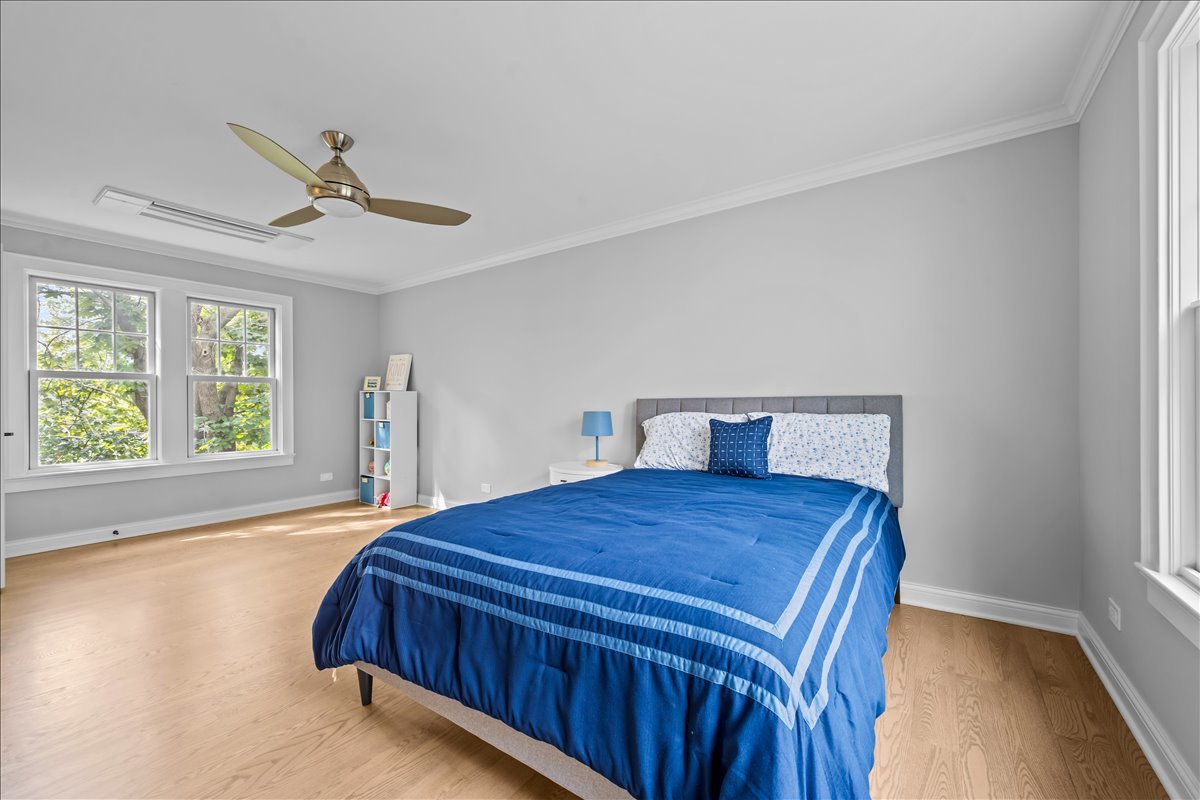 1625 Sunset Ridge Road Glenview, IL 60025 - Photo 42 of 49 a bedroom with a bed and window
