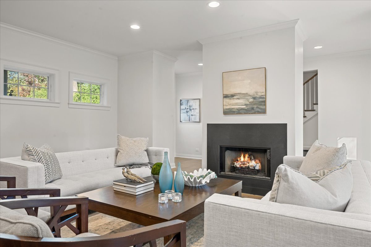 1625 Sunset Ridge Road Glenview, IL 60025 - Photo 9 of 49 a living room with furniture and a fireplace