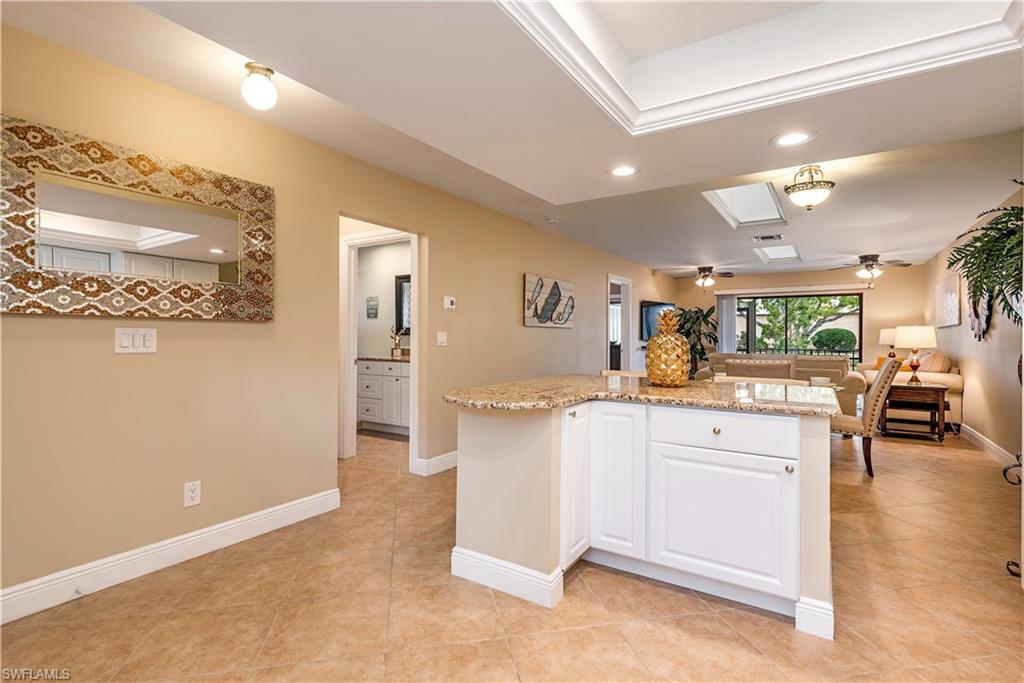 560 9th Avenue South Naples, FL 34102 - Photo 2 of 10 a kitchen with stainless steel appliances granite countertop a refrigerator and a sink