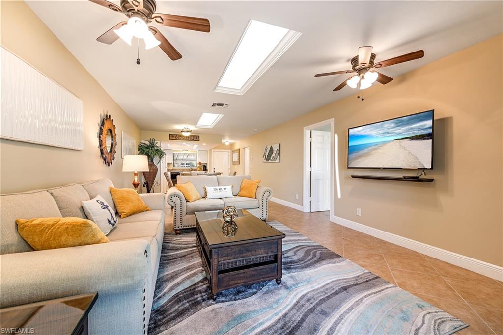 560 9th Avenue South Naples, FL 34102 - Photo 3 of 10 a living room with furniture and a ceiling fan