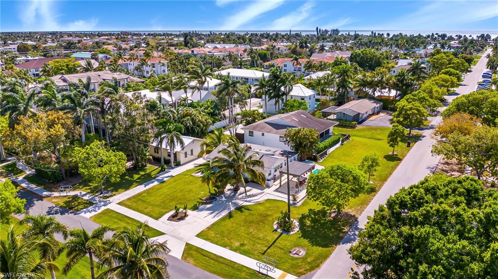 560 9th Avenue South Naples, FL 34102 - Photo 7 of 10 an aerial view of residential houses with outdoor space