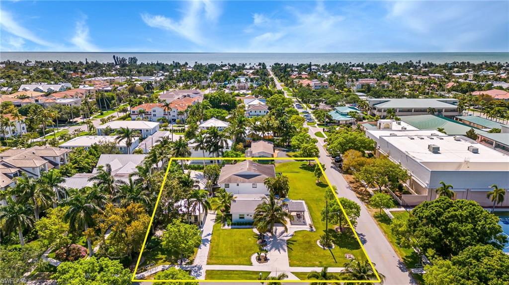 560 9th Avenue South Naples, FL 34102 - Photo 8 of 10 an aerial view of residential building with parking space