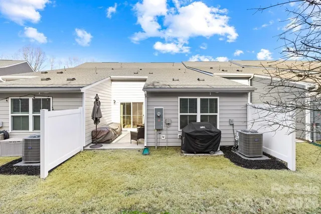 a view of a house with sitting area and garden