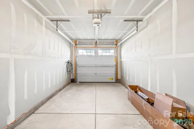 a view of a room with window and a ceiling fan