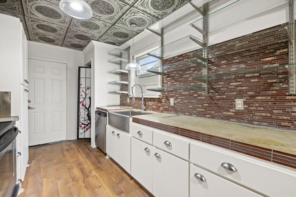 2204 Smith Avenue Taylor, TX 76574 - Photo 17 of 40 a kitchen with a sink and cabinets