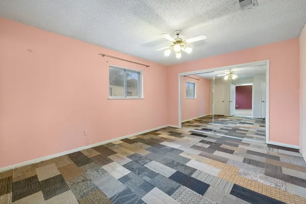 a view of a livingroom with a ceiling fan