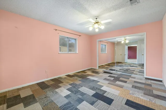 a view of a livingroom with a ceiling fan