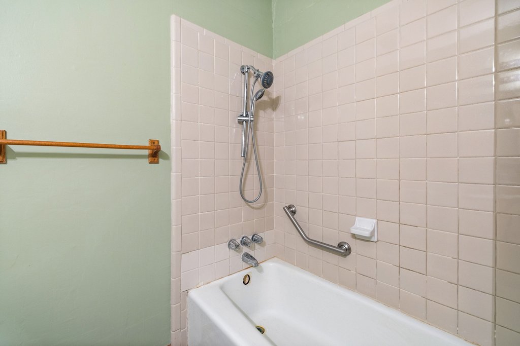 2204 Smith Avenue Taylor, TX 76574 - Photo 33 of 40 a bathroom with a white bath tub and shower