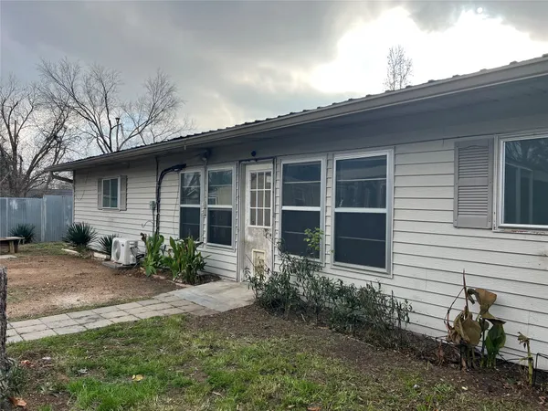 a outdoor space view with glass door and windows