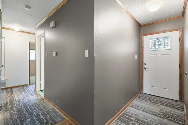 a view of hallway with wooden floor