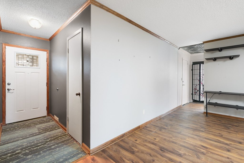 2204 Smith Avenue Taylor, TX 76574 - Photo 6 of 40 a view of a hallway with wooden floor