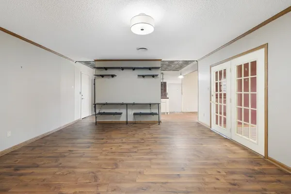 a view of an empty room with a window