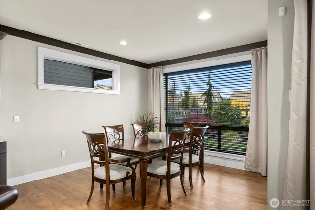 a spacious bedroom with a bed and dresser