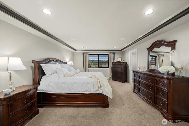 a bedroom with a bed and a lamp