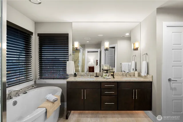 a bathroom with a shower and a sink