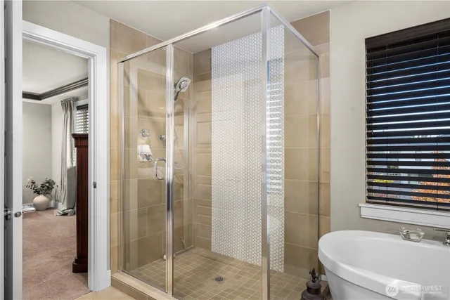 a bathroom with a bathtub and a sink