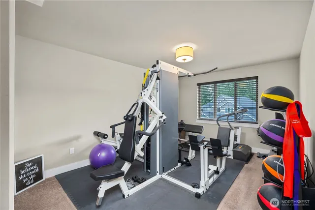 a living room with furniture a window and a fireplace