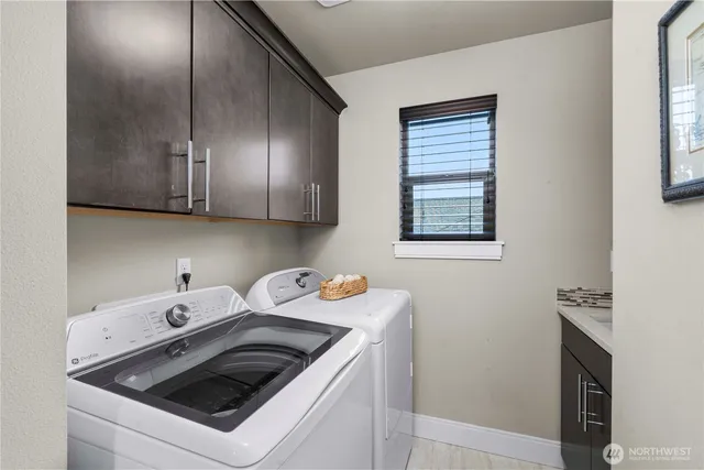 a bedroom with a bed and a lamp next to a window