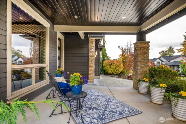 a view of a chairs and table in a patio