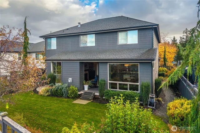 a front view of a house with a garden and patio