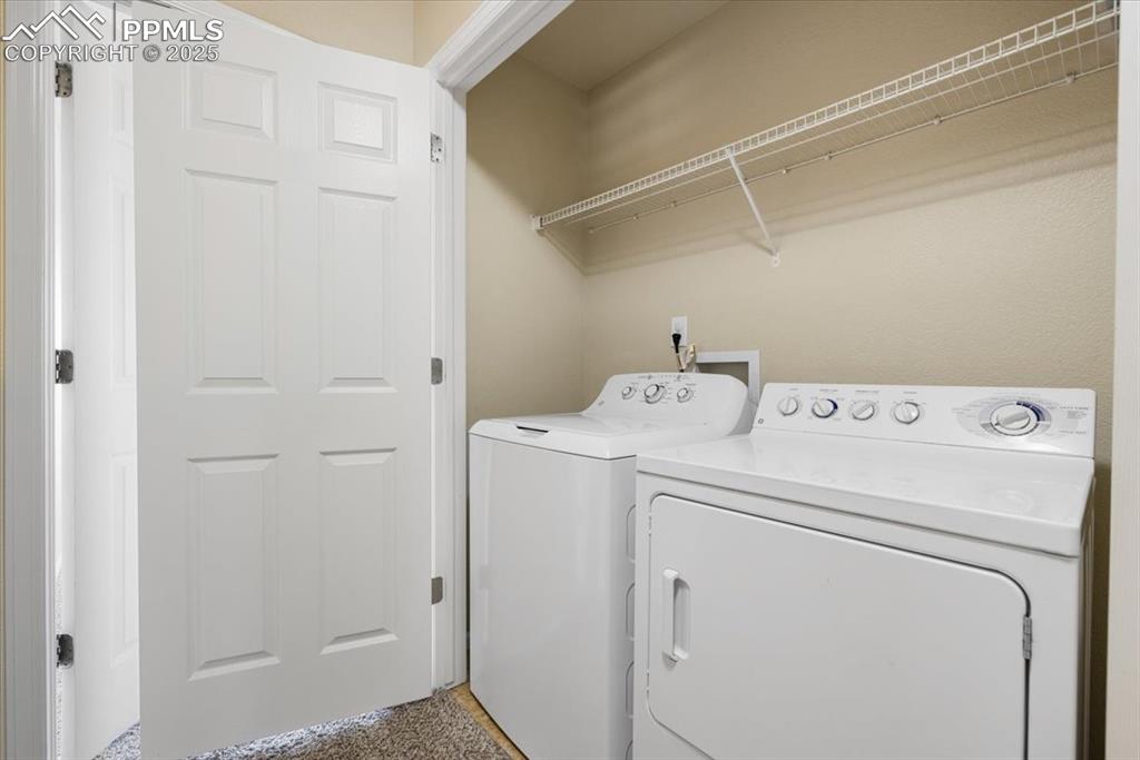 2740 Stonecrop Ridge Grove Colorado Springs, CO 80910 - Photo 25 of 42 Laundry area featuring washing machine and dryer