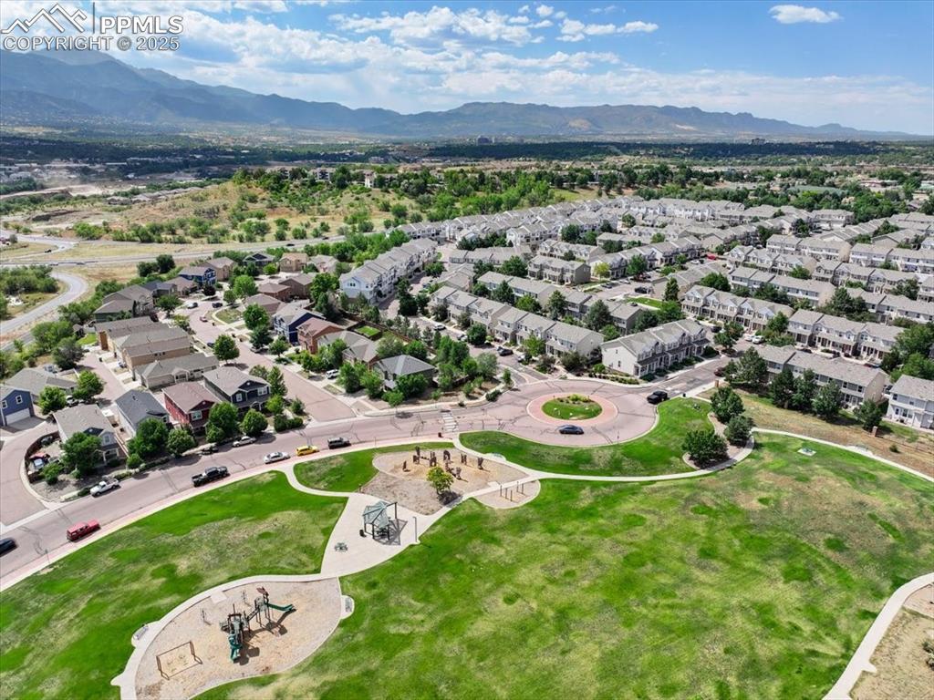 2740 Stonecrop Ridge Grove Colorado Springs, CO 80910 - Photo 40 of 42 Aerial perspective of suburban area featuring a mountainous background