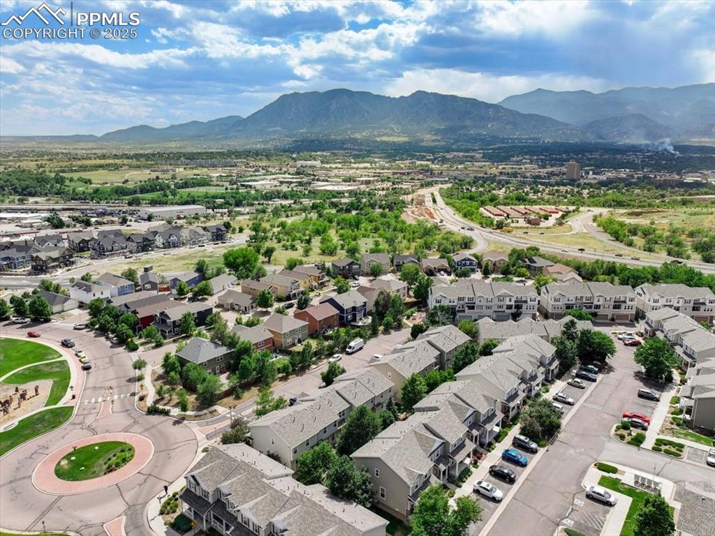 2740 Stonecrop Ridge Grove Colorado Springs, CO 80910 - Photo 42 of 42 Aerial view of residential area featuring a mountainous background