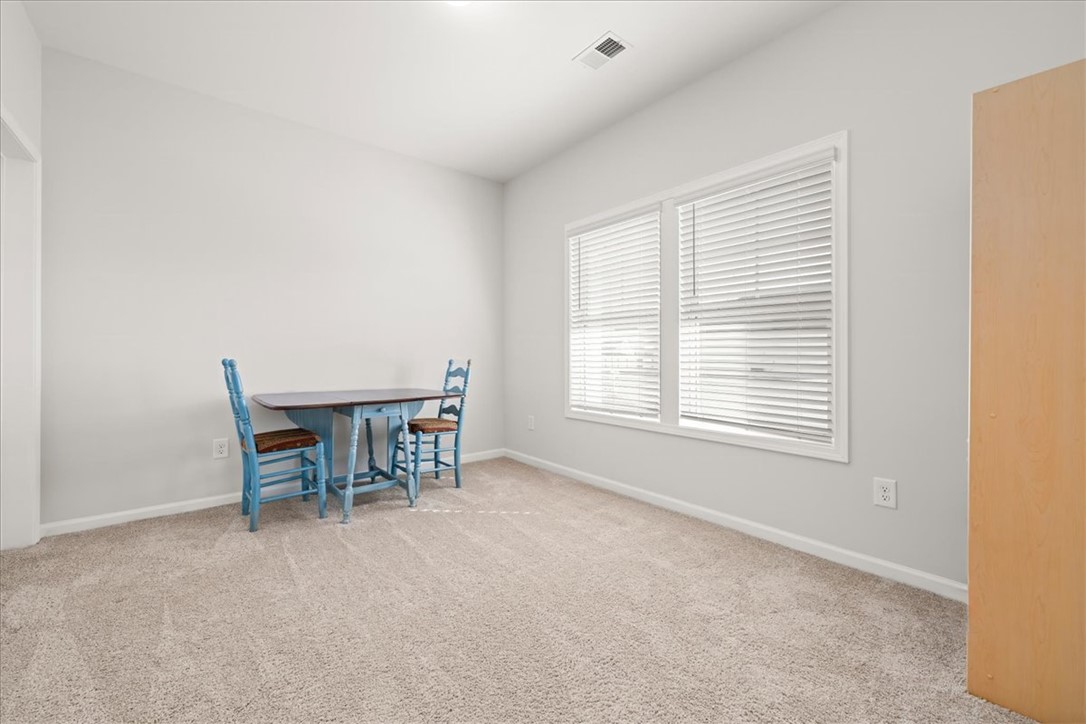 216 Carvel Trail Seneca, SC 29678 - Photo 17 of 46 This bright room features abundant natural light and soft carpeting, creating a comfortable living space.