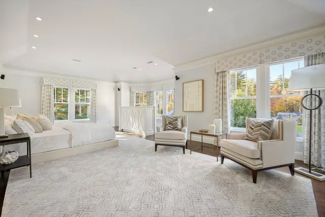 a aerial view of a house with a yard table and chairs