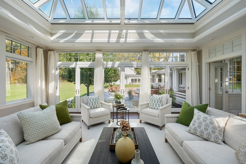 210 Monument Farm Road Concord, MA 01742 - Photo 6 of 42 a living room with furniture and floor to ceiling windows