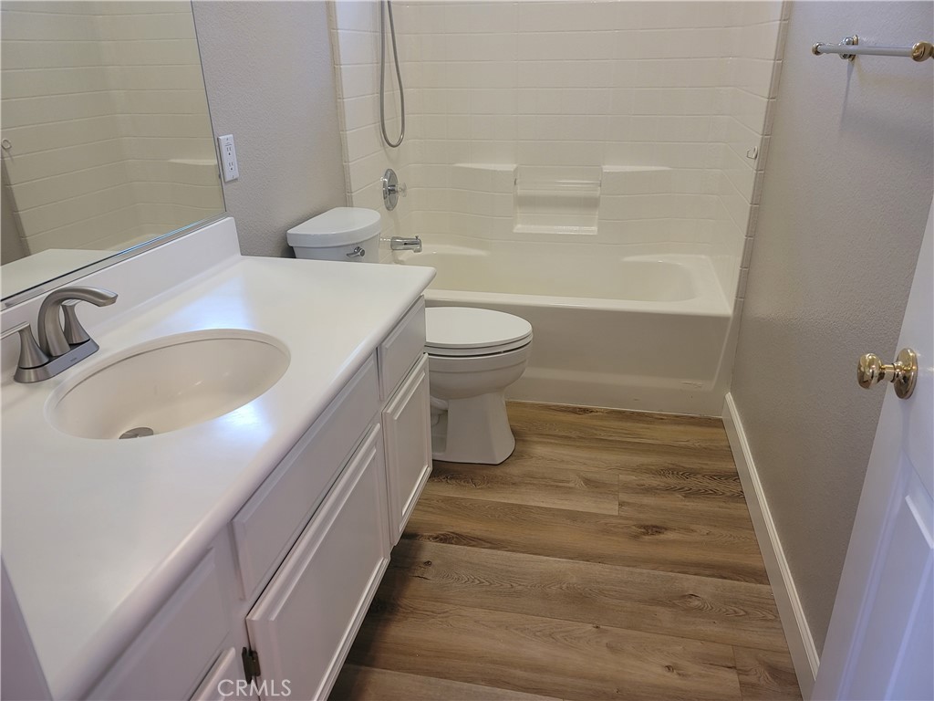 44915 Machon Road Temecula, CA 92592 - Photo 19 of 40 a bathroom with a sink and mirror with toilet