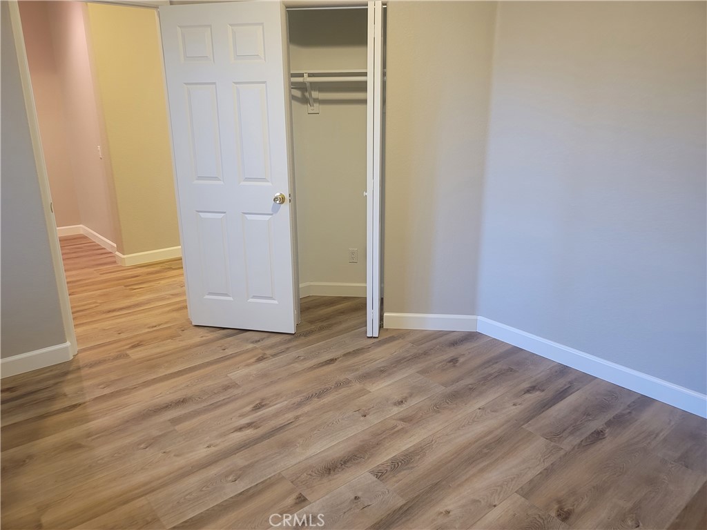 44915 Machon Road Temecula, CA 92592 - Photo 22 of 40 a view of wooden floor in an empty room
