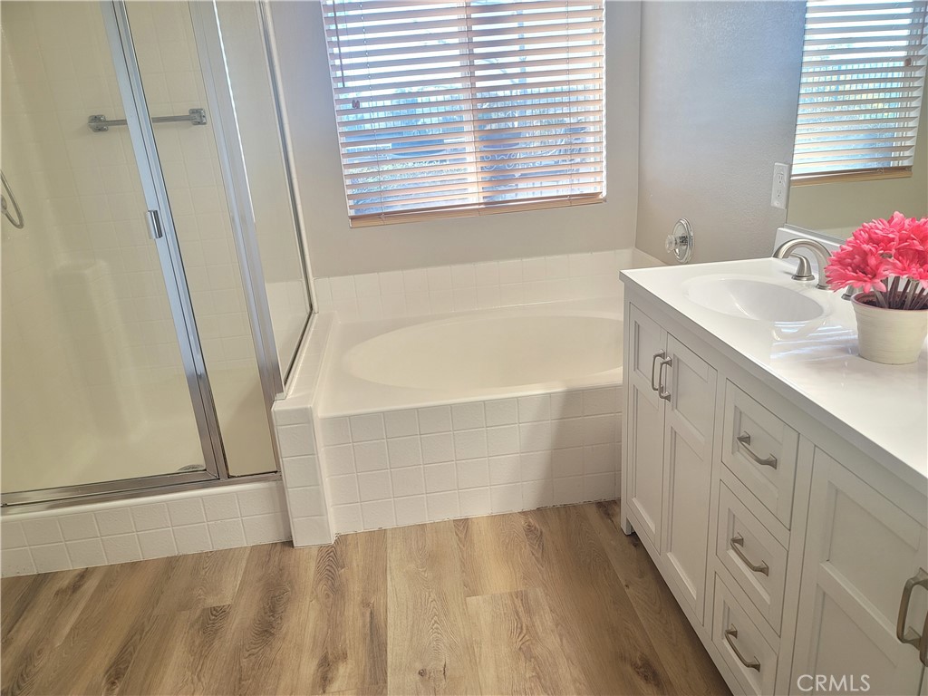 44915 Machon Road Temecula, CA 92592 - Photo 23 of 40 a bathroom with a tub sink and a window