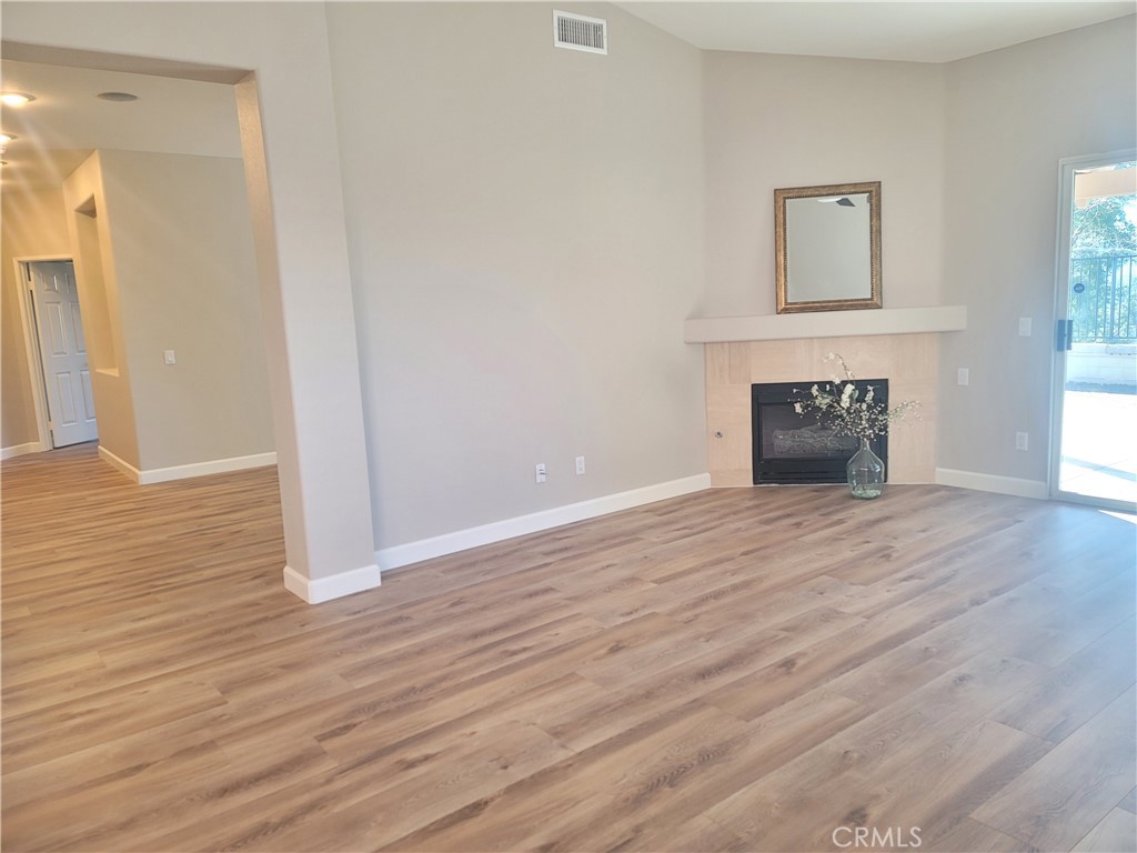 44915 Machon Road Temecula, CA 92592 - Photo 27 of 40 an empty room with wooden floor and windows