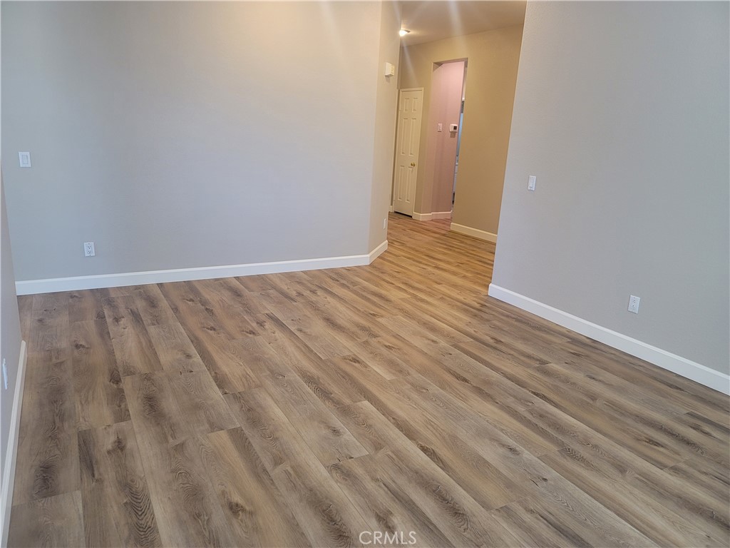 44915 Machon Road Temecula, CA 92592 - Photo 28 of 40 a view of an empty room with wooden floor