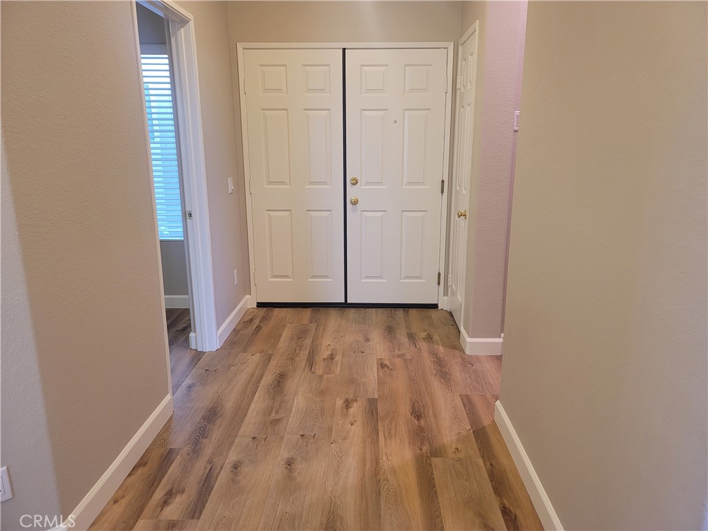 44915 Machon Road Temecula, CA 92592 - Photo 29 of 40 wooden floor in a hall with an empty room